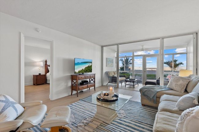 Living Room with a peak of the Primary Bedroom | Image 15