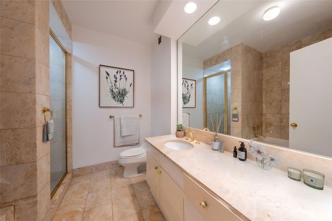 Full bath featuring a shower stall and vanity | Image 7