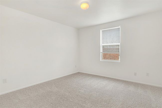 Carpeted spare room featuring baseboards | Image 22