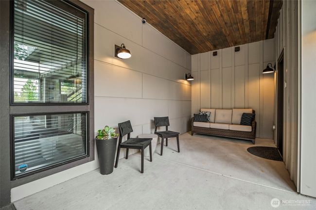 Another front porch seating area or perfect place to store skiing equipment after a long day on the slopes | Image 33