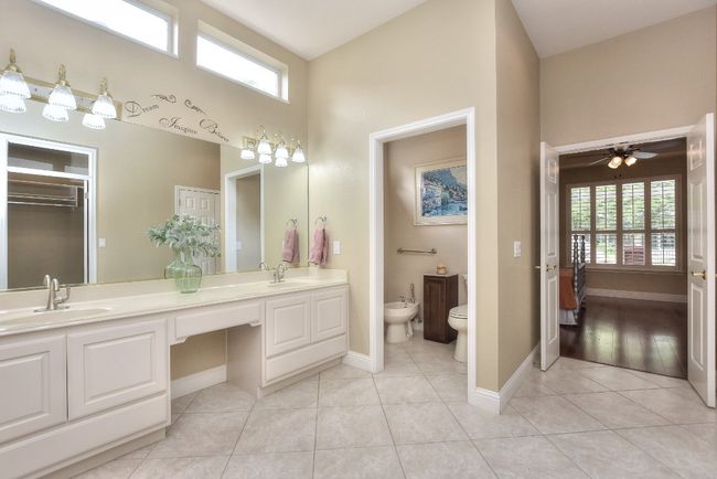 Toilet and Bidet with storage shelf in separate alcove. | Image 20
