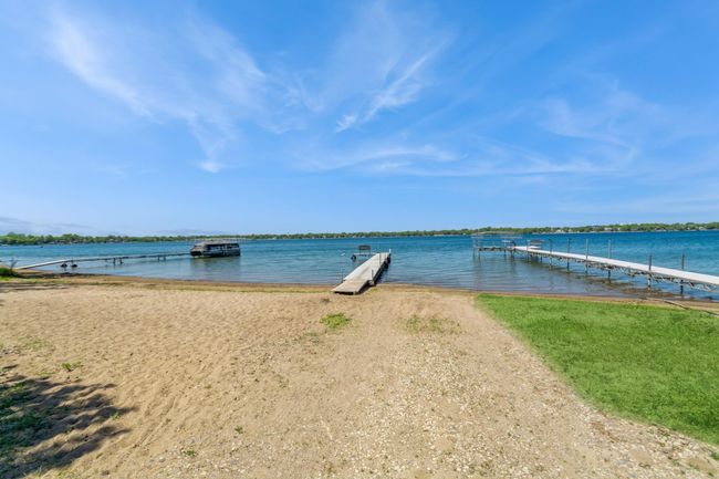 This home has an association maintained beach area that comes with use of the dock and picnic areas. It is located about a half block from this home. The association dues are currently $70 a year. | Image 9