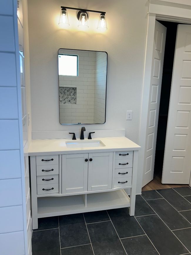 Bathroom with vanity and tile patterned floors | Image 18