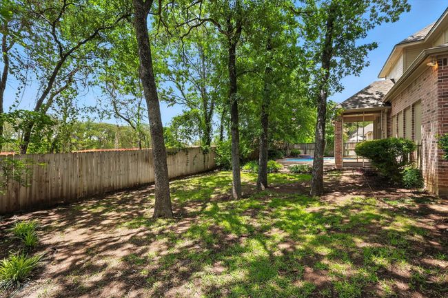 View of fenced backyard | Image 28