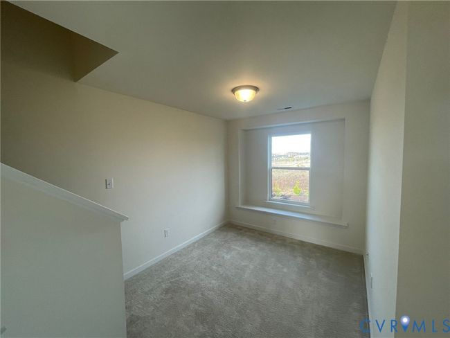 Carpeted spare room featuring baseboards | Image 15