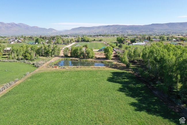 Aerial view of property's location featuring a water and mountain view | Image 27