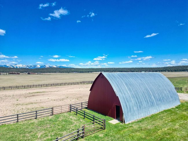 View of barn with fence, a rural view, and a yard | Image 126