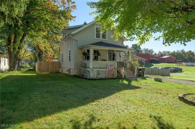 View of front facade with a front lawn and a porch | Image 3