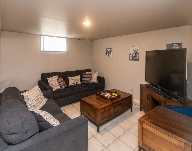 Living area featuring light tile patterned floors | Image 18