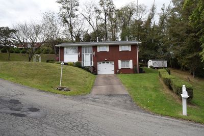 Home and yard from across street | Image 2