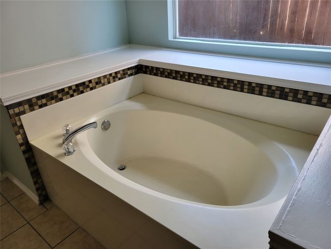 Bathroom featuring a bath and tile patterned flooring | Image 23
