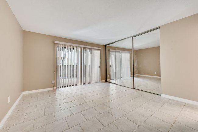 Unfurnished room featuring light tile patterned floors and baseboards | Image 5