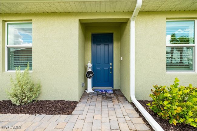 Doorway to property with stucco siding | Image 5