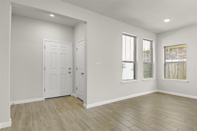Unfurnished room featuring baseboards, light wood finished floors, and recessed lighting | Image 5