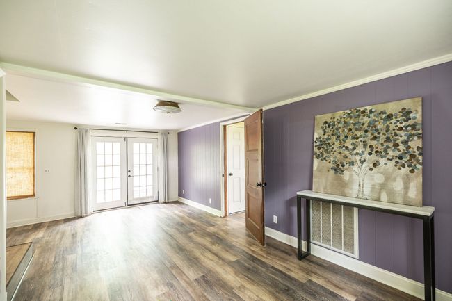 You get to decide how this space would best accommodate you. There is also access to the back yard and patio from here. | Image 44