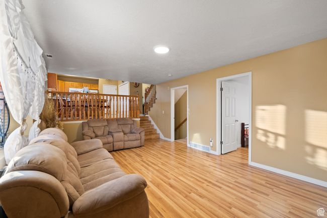 Living room featuring light hardwood / wood-style flooring | Image 27