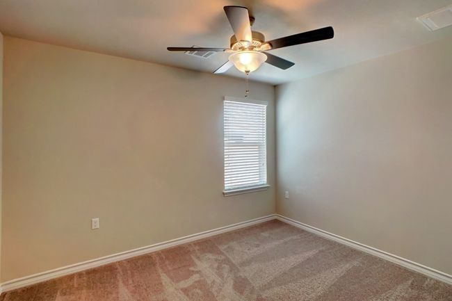 Unfurnished room featuring baseboards, ceiling fan, visible vents, and light carpet | Image 19