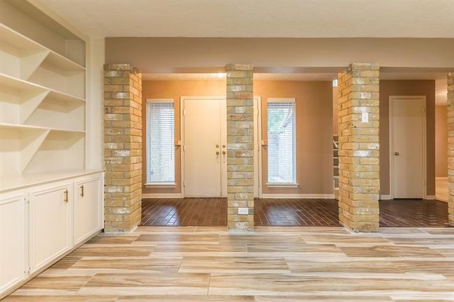 Living area boast beautiful painted cabinetry | Image 6