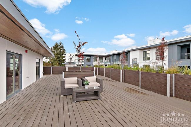 Wooden deck with a residential view | Image 32