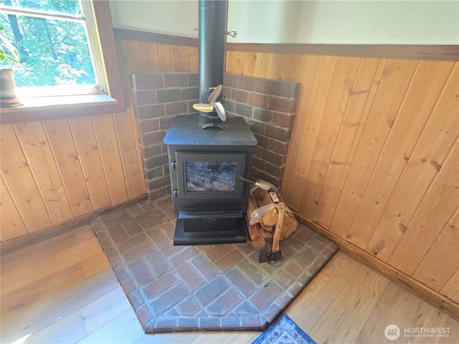 In addition to wall heaters, this cool wood stove will heat the entire home. Save electricity and you can even cook on it. | Image 6