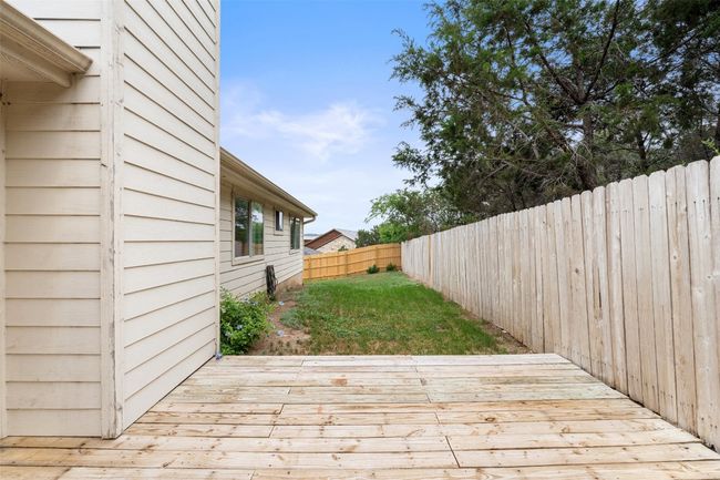 Wooden terrace featuring a fenced backyard | Image 36