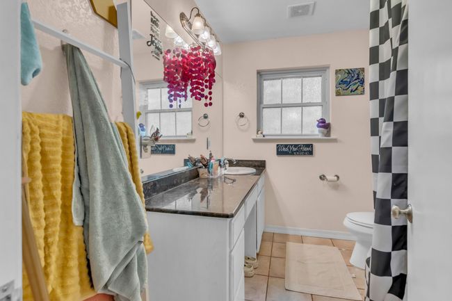 Full bath with vanity and tile patterned floors | Image 21