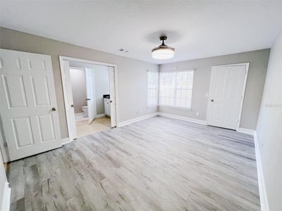 downstairs bedroom - lots of lights and brand new blinds throughout the entire house | Image 3