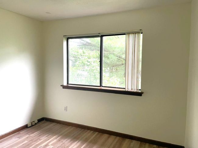 Spare room featuring wood finished floors | Image 16