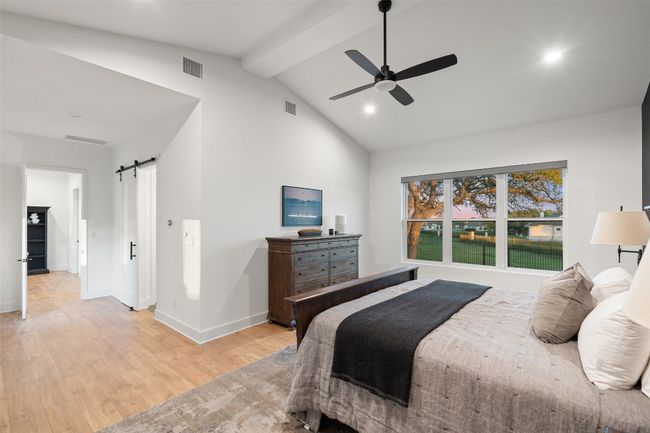 Primary Bedroom with Vaulted Ceilings and designer accent wall and private access to back pool deck. | Image 21