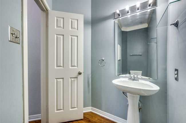 Bathroom featuring wood finished floors and baseboards | Image 10