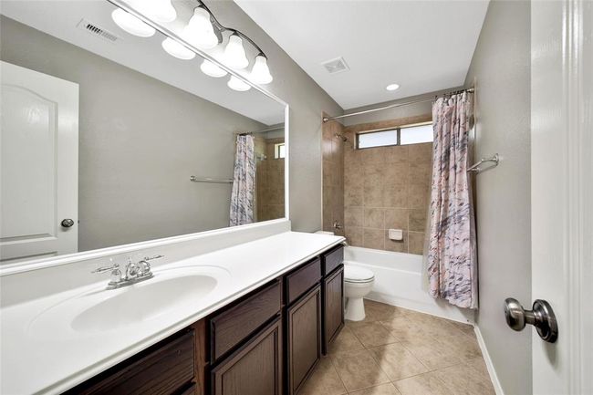 The secondary bathroom is conveniently located between the secondary bedrooms. | Image 26