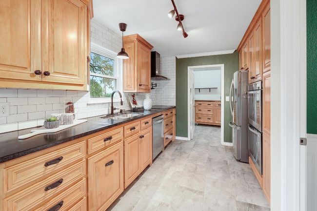 Brand new stainless steel appliances, soapstone countertops and a gorgeous view from the window. | Image 4