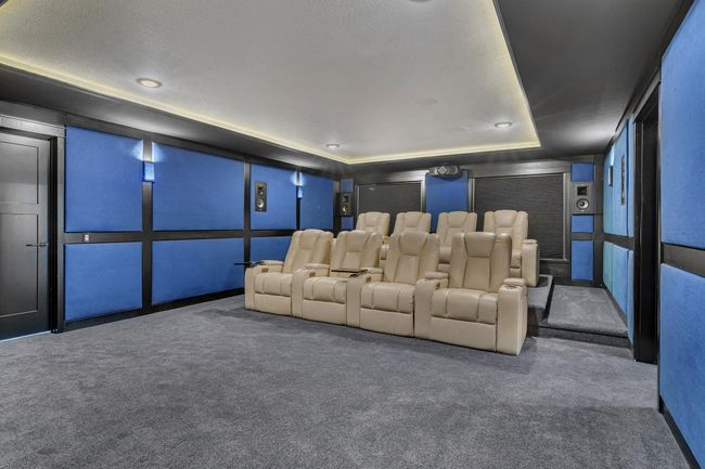 Theater room with tiered seating for optimal viewing, designed for comfort and a true cinematic experience at home. | Image 75