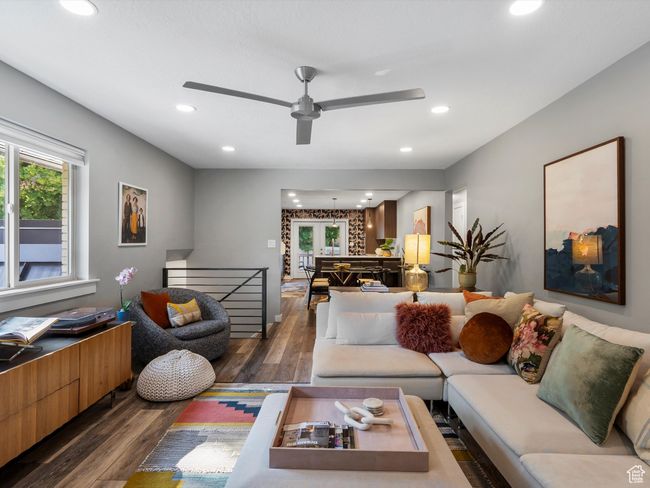 Living area with dark wood finished floors, recessed lighting, and a ceiling fan | Image 10