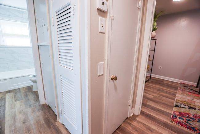 Corridor featuring baseboards and wood finished floors | Image 23