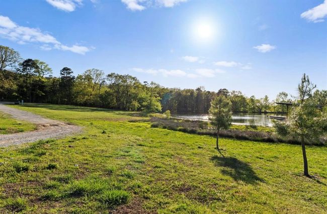 View of yard with a forest view and a water view | Image 23