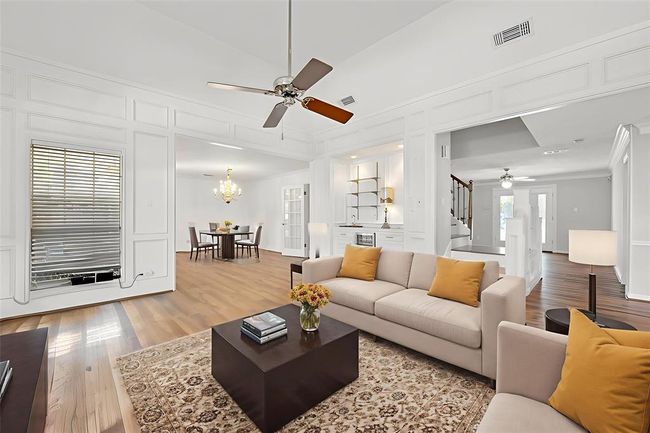 Imagine the living and dining rooms, through this virtually staged photo, with your furniture in them. | Image 4