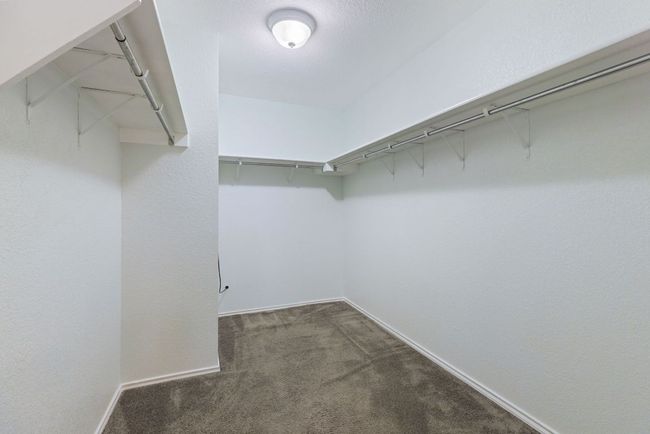 Spacious closet featuring carpet floors | Image 24