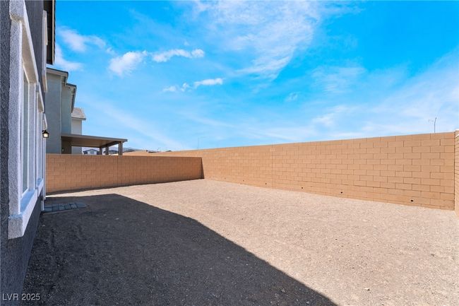 View of fenced backyard | Image 38