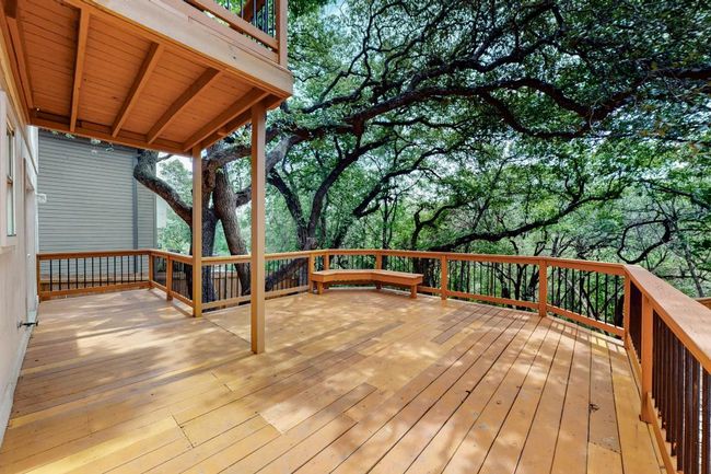 Wooden terrace with view of wooded area | Image 33