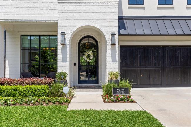 Gas Lanterns & Ebony Stained wood panel garage door. | Image 6