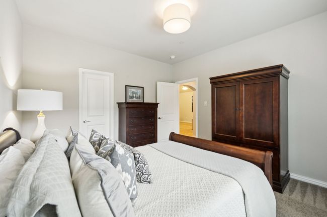 Bedroom featuring light colored carpet and baseboards | Image 17