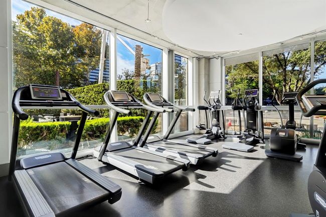 Resident fitness center with scenic views overlooking Post Oak Boulevard. | Image 18