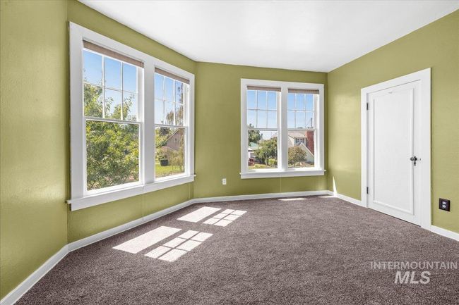 Carpeted spare room with baseboards | Image 44