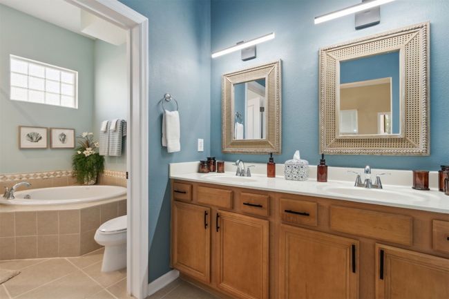 Dual vanity and spacious CUSTOM walk-in closet. | Image 16