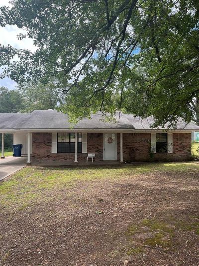 Single story home featuring a front yard | Image 1