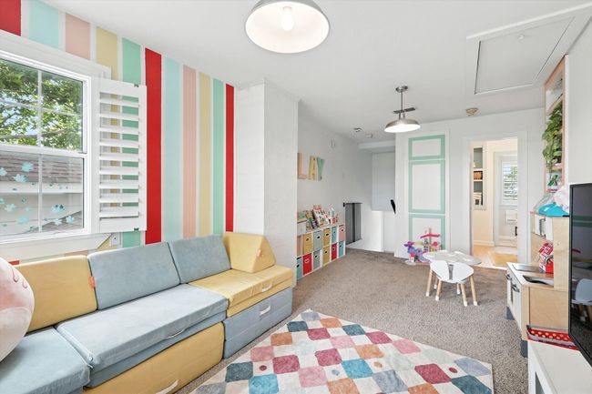 Recreation room with carpet and wallpapered walls | Image 26
