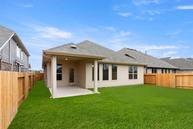 Picture a spacious patio, perfect for summer barbecues and lazy Sunday brunches with friends. | Image 24
