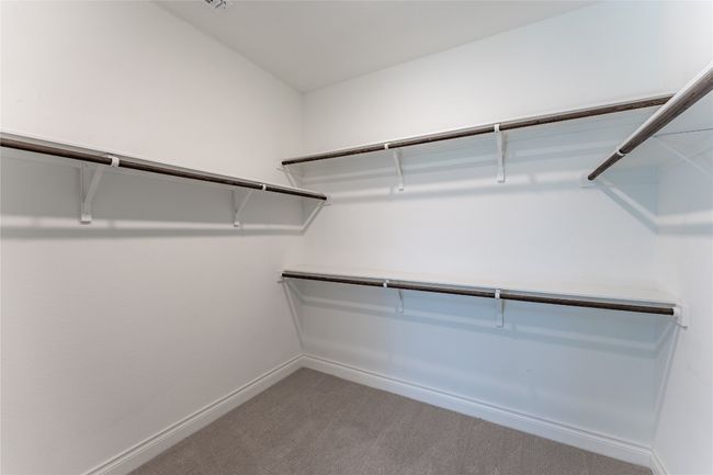 Spacious closet featuring carpet flooring | Image 28