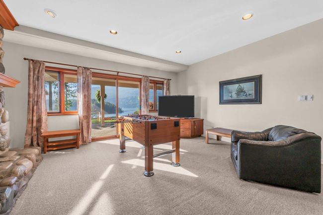 Playroom featuring light colored carpet, plenty of natural light, and recessed lighting | Image 31